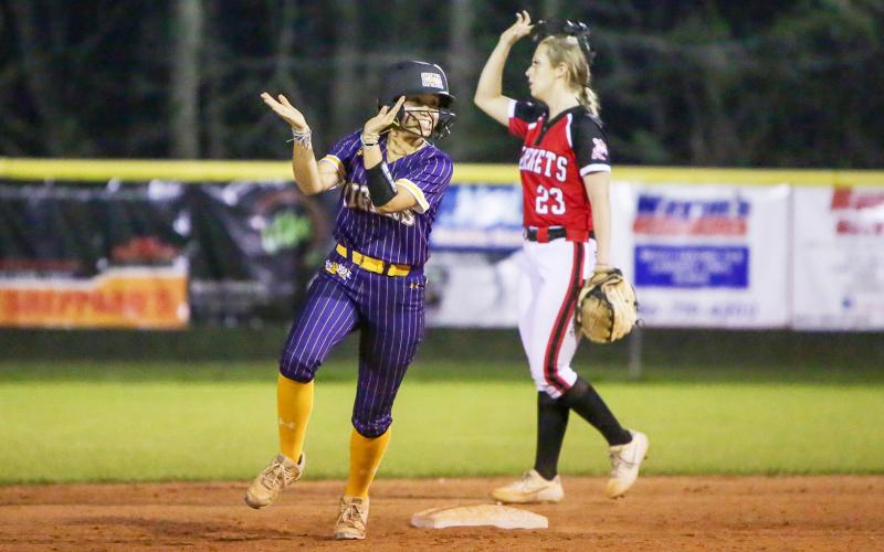 Columbia outfielder Luisa Taylor celebrates coming off second base after McKenna O’Sullivan hit a home run against Lafayette on Tuesday night. (BRENT KUYKENDALL/Lake City Reporter)