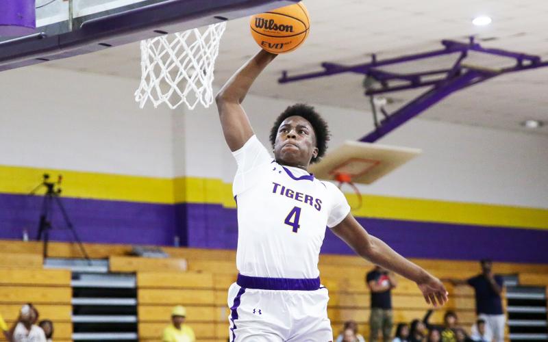 Columbia forward Ty’jahn Wright rises for a dunk against Pine Forest during the Region 1-5A quarterfinals on Thursday. (BRENT KUYKENDALL/Lake City Reporter)