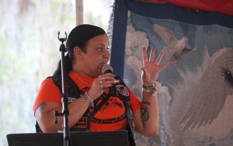 Carol Tunsil with the Uniqu3 Ryderz urged the community to say something when they see something in regards to gun violence during Sunday’s community rally. (JAMIE WACHTER/Lake City Reporter)