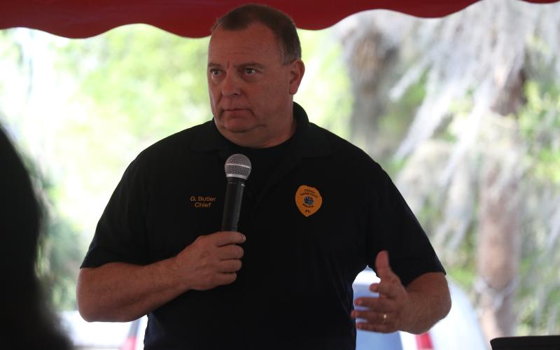 Lake City Police Chief Gerald Butler speaks Sunday at a rally against gun violence organized by the Gateway Ministerial Alliance. The rally occurred a few hours after and a couple blocks away from an incident where four people were injured by gunfire. (JAMIE WACHTER/Lake City Reporter)