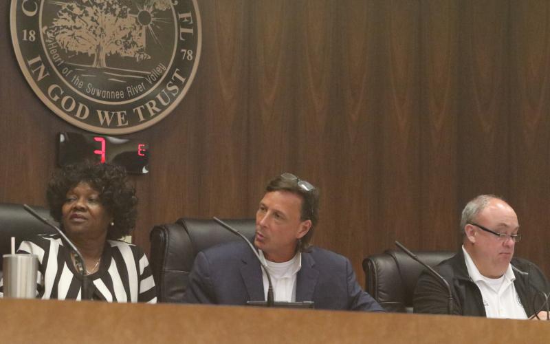 Live Oak Council President David Burch (center) responds to councilor Tommie Jefferson as fellow councilor Linda Owens looks on during Tuesday’s meeting. (JAMIE WACHTER/Lake City Reporter)
