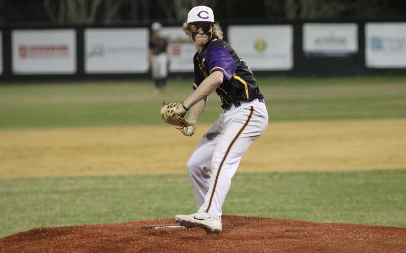 Columbia pitcher Trayce McKenzie-Starling winds up to throw against Gainesville on March 3. (JORDAN KROEGER/Lake City Reporter)