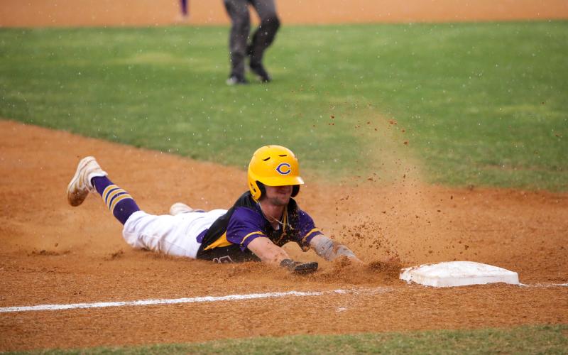 Columbia designated hitter Matt Dumas slides safely into third base against Union County on Tuesday. Dumas scored via a throwing error on the play. (BRENT KUYKENDALL/Lake City Reporter)