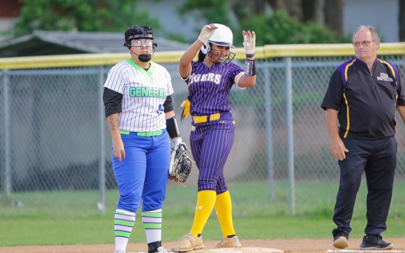 Columbia outfielder Karis Jernigan celebrates after reaching first base safely against Riverside on Thursday night. (BRENT KUYKENDALL/Lake City Reporter)