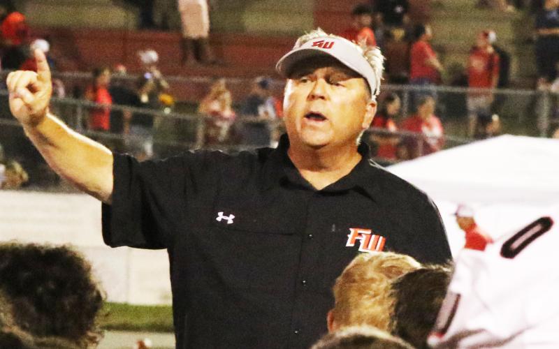 Former Fort White head coach Lee Dorsett addresses his team following a loss to Williston on Sept. 23, 2022. (MORGAN MCMULLEN/Lake City Reporter)