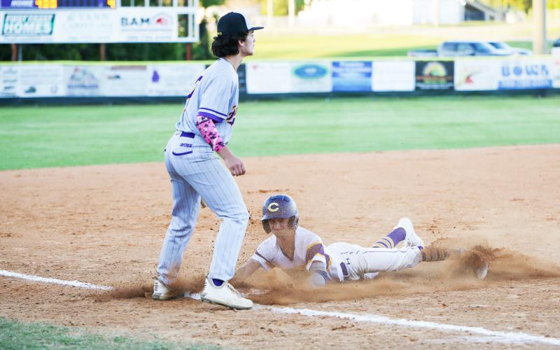Columbia’s Matt Dumas slides safely into third base against Lake Weir on Wednesday night. (BRENT KUYKENDALL/Lake City Reporter)