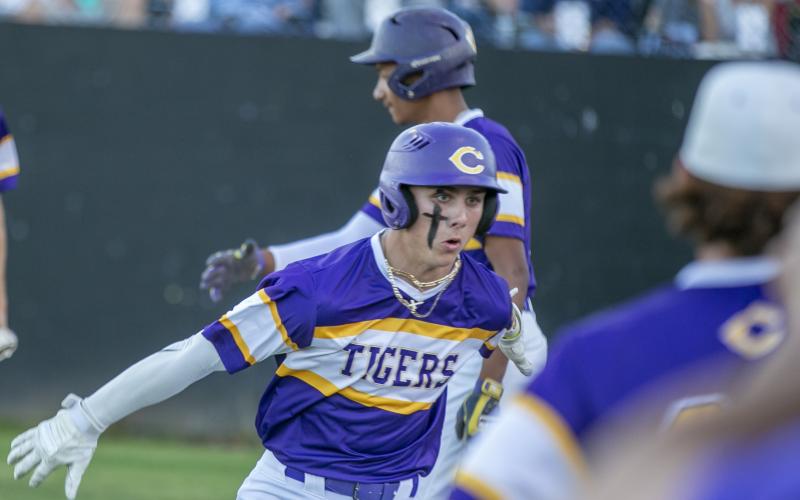 Columbia Camdon Frier celebrates after hitting a grand slam against Santa Fe on Friday. (ALAN YOUNGBLOOD/Special to the Reporter)