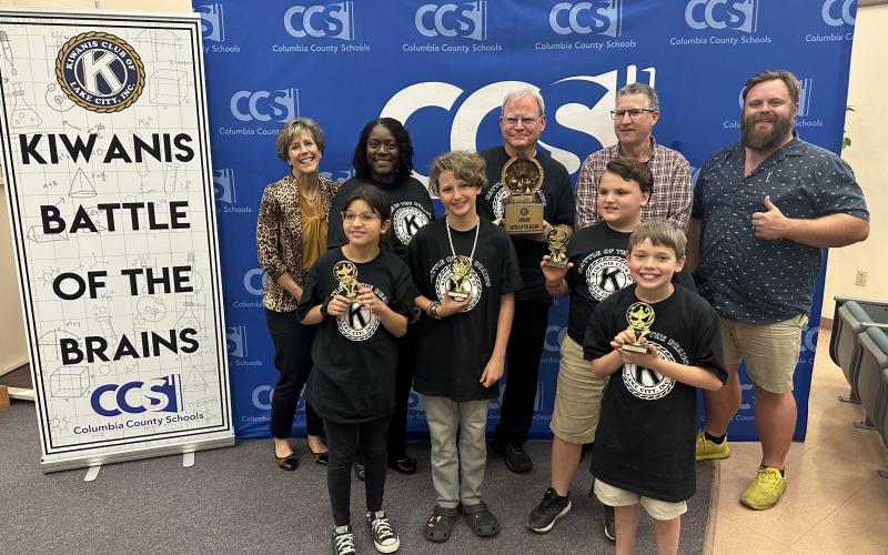 Fort White Elementary School won the 2023 Kiwanis Battle of the Brains on Thursday. Team members, in front, include Sarah Rafael (from left), Wyatt Chism,Tucker Ayers and Brayden Blalock. They are joined in back by Stephanie Lunde, Dr. Marilyn Gassett, Alan Gatzke, John Kasak, and James Carter, the president of Lake City Kiwanis Club. (COURTESY)