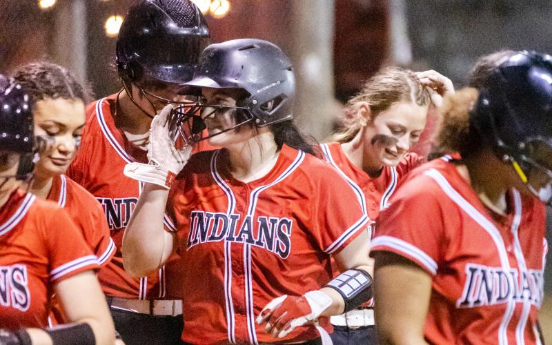 Fort White pitcher Kadence Compton celebrates with teammates after hitting a home run against Lafayette on Tuesday night. (JACK HOWDESHELL/Special to the Reporter)