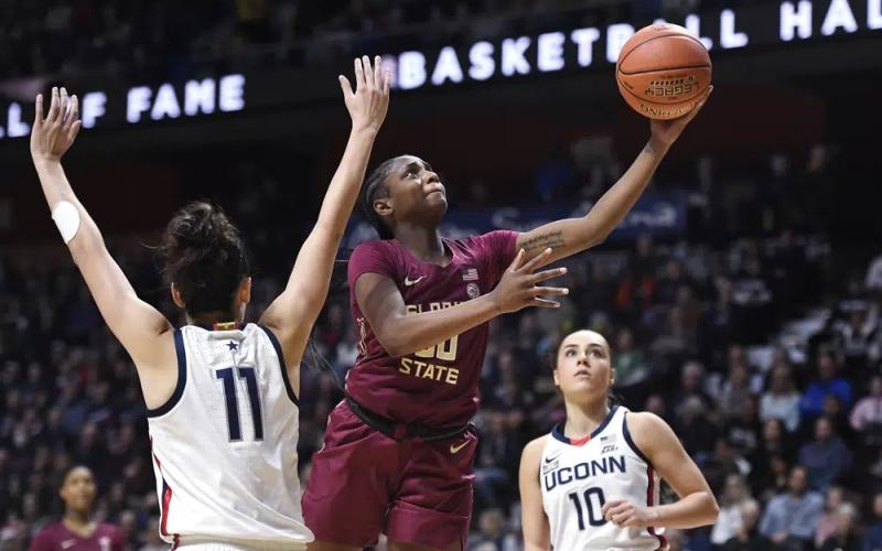 Florida State’s Ta’niya Latson goes up for a basket as Connecticut’s Lou Lopez-Senechal (11) defends on Dec. 18, 2022, in Uncasville, Conn. (JESSICA HILL/AP File)