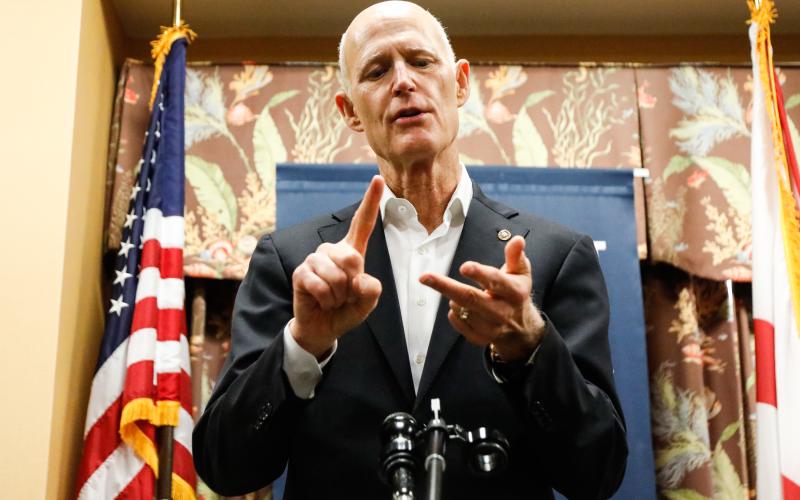 U.S. Sen. Rick Scott speaks to reporters during a round table discussion at the Sun Towers Retirement Community on Feb. 10 in Sun City Center. (Jefferee Woo/Tampa Bay Times/TNS)