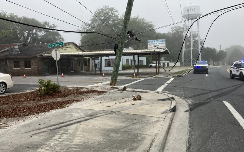 A utility pole was snapped off at the ground when the semi truck left U.S. Highway 27 on Tuesday morning in Mayo. (COURTESY FLORIDA HIGHWAY PATROL)