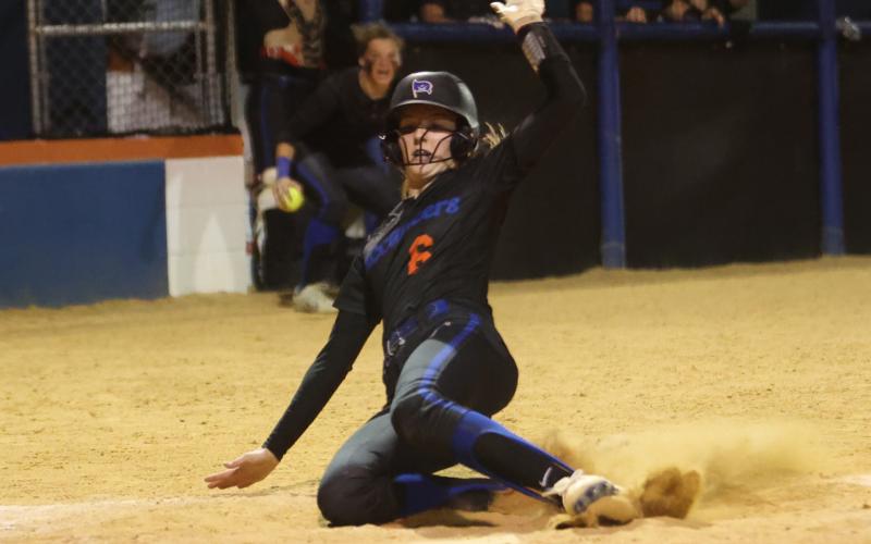 Branford’s Madyson Sikes slides into home plate to score the game-winning run against Suwannee on April 11. (PAUL BUCHANAN/Special to the Reporter)