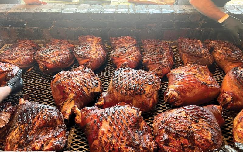 Meat sits on the smoker at Jack’s Old South, the competitive cooking team led by Myron Mixon, the winningest man in barbecue. Mixon and Jack’s Old South are among the 32 teams competing at this weekend’s Downtown Showdown BBQ Cook-off in downtown Lake City. (COURTESY)