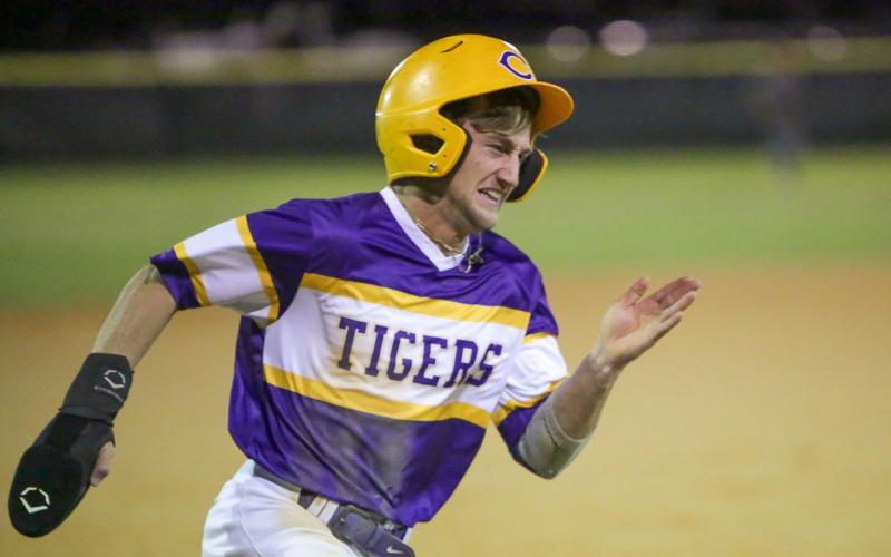 Columbia’s Matt Dumas strains as he rounds third base during Wednesday’s 8-5 loss to Chiles. (BRENT KUYKENDALL/Special to the Reporter)