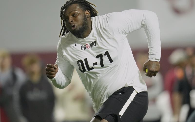Oklahoma offensive lineman Anton Harrison participates in a drill during his pro day on March 30 in Norman, Okla. (SUE OGROCKI/Associated Press)