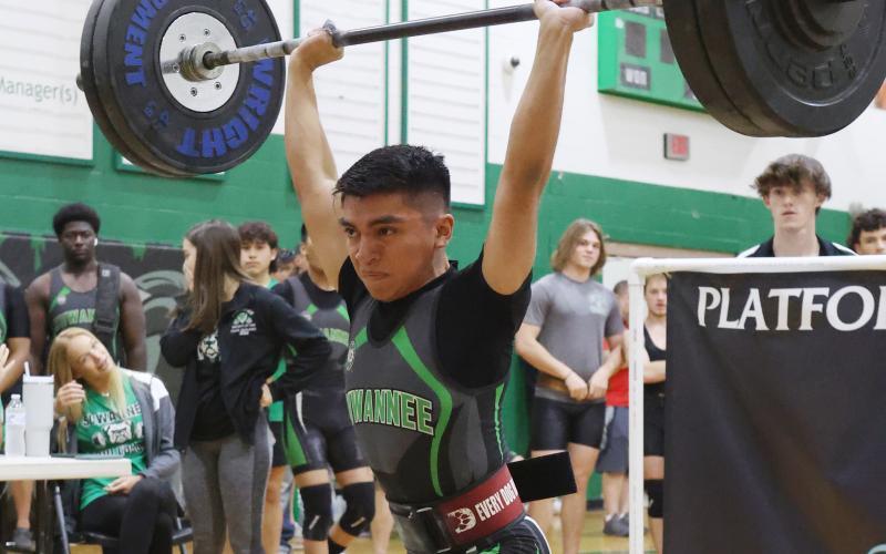 Suwannee’s Chris Gonzalez performs the clean and jerk during the Region 2-1A meet on Friday. Gonzalez won regional titles in the traditional and Olympic in the 119 weight class to qualify for state in both events. (PAUL BUCHANAN/Special to the Reporter)