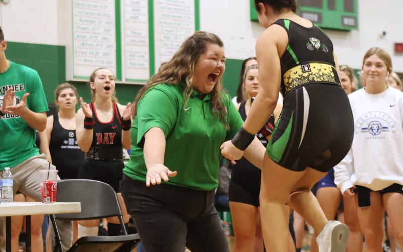 Suwannee head coach Brittney Shearer celebrates after Elisia Beauchamp completed her clean and jerk during the Region 1-1A meet on Feb. 4. (PAUL BUCHANAN/Special to the Reporter)