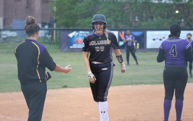 Columbia pitcher McKenna O’Sullivan celebrates on third after hitting an RBI double earlier in the first inning against Gainesville on Wednesday night. (JORDAN KROEGER/Lake City Reporter)
