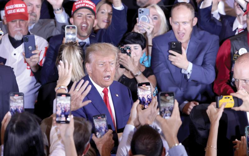 Former President Donald Trump arrives at an event at Mar-a-Lago on Tuesday in West Palm Beach after being arraigned on 34 felony counts earlier in the day. (ALEX WONG/Getty Images/TNS)
