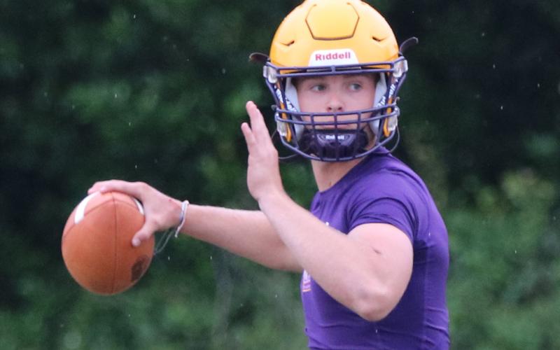 Columbia quarterback Evan Umstead drop backs to pass during Monday’s practice. (JORDAN KROEGER/Lake City Reporter)