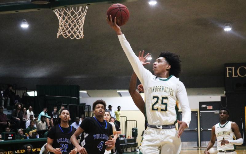 FGC guard Antewan Webber rises for a layup against Pitt CC in the South Atlantic District B championship on March 11. (JORDAN KROEGER/Lake City Reporter)