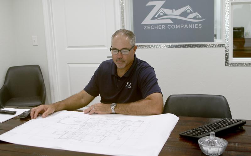 Bryan Zecher, looking over blueprints for a home in the Zecher Companies’ office on State Road 47, has been named the best Custom Builder in the U.S., according to the Avid Ratings’ annual awards, which are based on customer satisfaction surveys. (FILE)