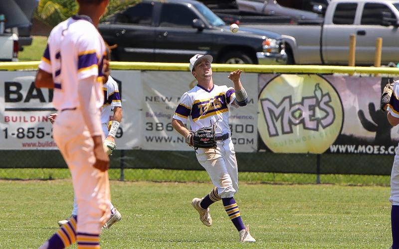 Columbia centerfielder Matt Dumas tosses the ball back to the infield after catching an out against Lincoln on Saturday in the Region 1-5A semifinals. (BRENT KUYKENDALL/Lake City Reporter)