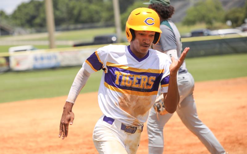 Columbia shortstop Brayden Thomas rounds third base to score a run against Lincoln in the fifth inning Saturday in the Region 1-5A semifinals. (BRENT KUYKENDALL/Lake City Reporter)