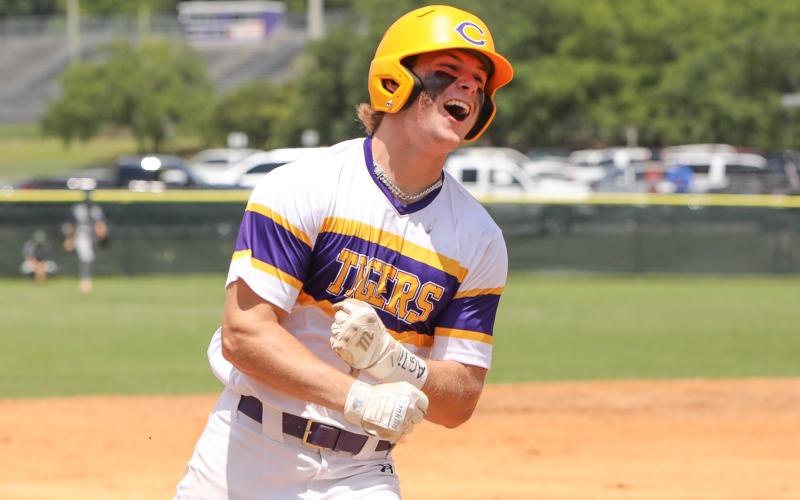 Columbia first baseman Josh Fernald celebrates rounding third base after hitting a walk-off grand slam against Lincoln on Saturday in the Region 1-5A semifinals. (BRENT KUYKENDALL/Lake City Reporter)