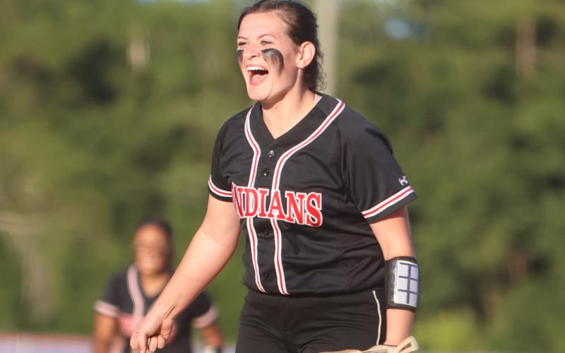 Fort White pitcher Kadence Compton celebrates after a strikeout against Union County in the District 6-1A semifinals on Tuesday night. (PAUL BUCHANAN/Special to the Reporter)