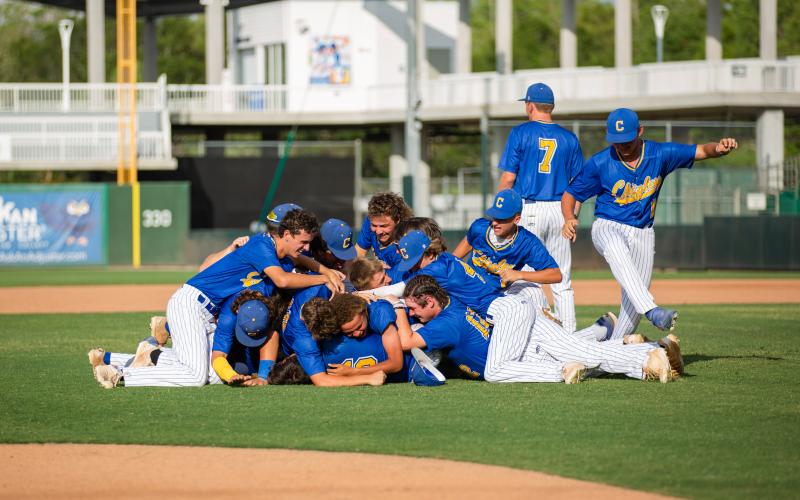 Chipley's baseball team dogpiles in celebration after defeating Lafayette to win the Class 1A state title on Thursday at Hammond Stadium in Fort Myers. (JESSICA PINALD/Special to the Reporter)