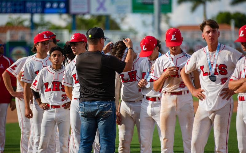 Lafayette's baseball players receive their runner-up medals after losing to Chipley in the Class 1A state championship game on Thursday at Hammond Stadium in Fort Myers. (JESSICA PINALD/Special to the Reporter)