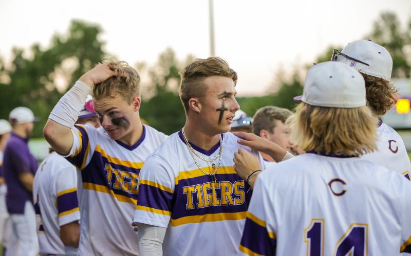 Columbia players regroup in the dugout after Camdon Frier (middle) hit a home run against Lincoln in the District 2-5A championship on Wednesday. (BRENT KUYKENDALL/Lake City Reporter)