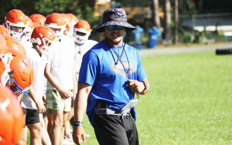 Branford head coach Tim Clark watches over conditioning at the end of practice on May 4. (JAMIE WACHTER/Lake City Reporter)