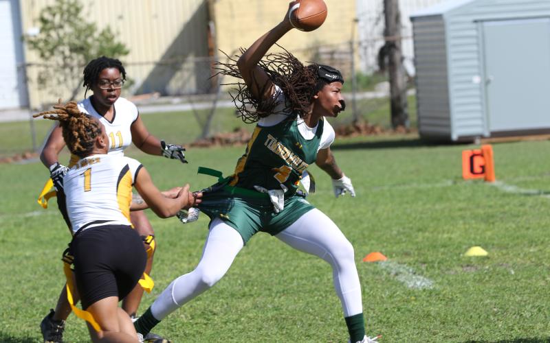 FGC receiver Destiny Lockett splits a pair of Xavier defenders on Feb. 25. (JAMIE WACHTER/Lake City Reporter)