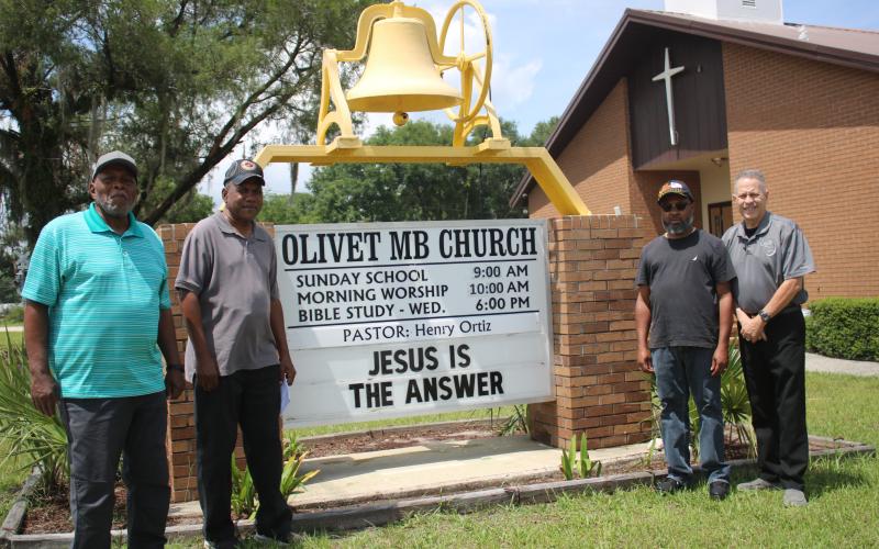 Members of the Olivet Missionary Baptist Church military ministry (from left) Thomas Acree, Harold Perry, Sean Dunmore and church pastor Henry Ortiz placed a total of more than 2,000 flags in 17 local cemeteries in honor of veterans on Memorial Day. (TONY BRITT/Lake City Reporter)