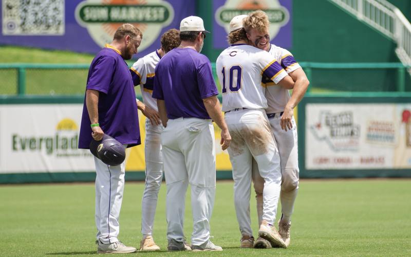 Columbia pitcher Josh Fernald (10) and his coaches console catcher Hayden Gustavson following the Tigers' 5-2 loss to American Heritage in the Class 5A state semifinals on Monday at Hammond Stadium in Fort Myers. (JESSICA PILAND/Special to the Reporter)