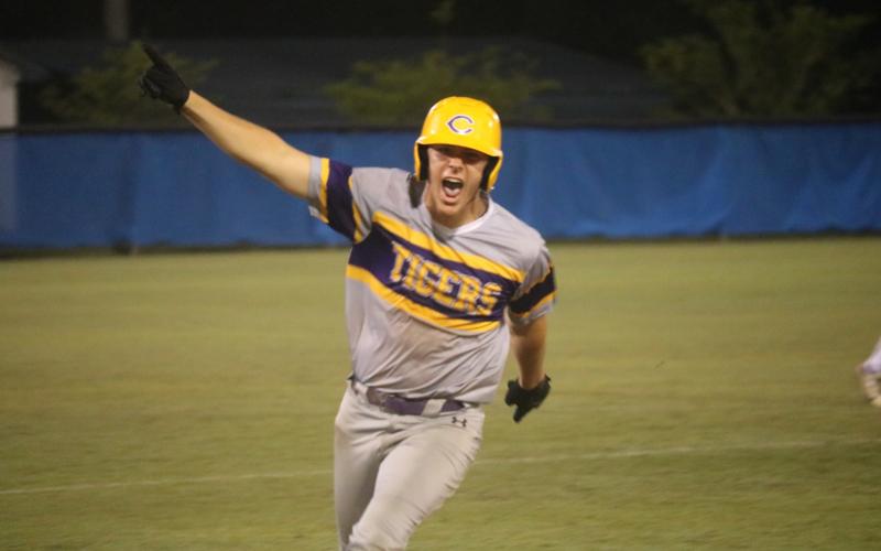 Columbia’s Ayden Phillips celebrates as he approaches third base on his grand slam in the seventh inning Tuesday at Clay. (JORDAN KROEGER/Lake City Reporter)