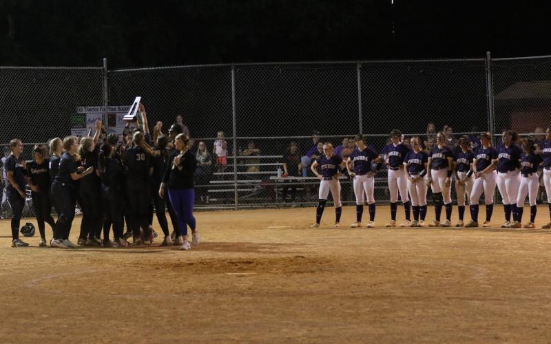 Columbia players look on as Ridgeview celebrates with the District 2-5A trophy on Thursday night. (MORGAN MCMULLEN/Lake City Reporter)