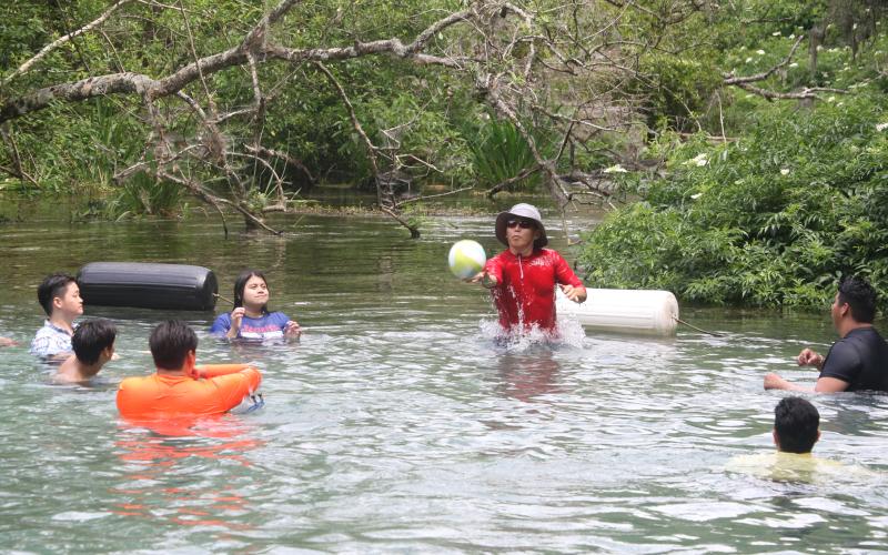 A group of park visitors plays an impromptu game of volleyball Monday afternoon at Ichetucknee Springs State Park. (MORGAN MCMULLEN/Lake City Reporter)