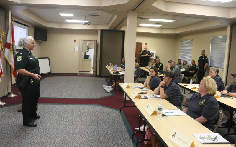 Columbia County Sheriff’s Office Maj. Katina Dicks (left) answers a question from a participant during Tuesday’s Citizen’s Law Enforcement Academy. (MORGAN MCMULLEN/Lake City Reporter)