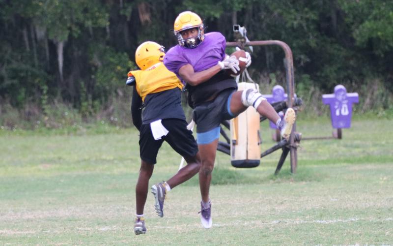 Columbia cornerback Markeyon Moore intercepts a pass during Wednesday’s practice. (JORDAN KROEGER/Lake City Reporter)
