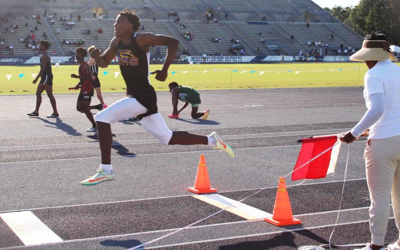 Columbia’s Seth Stockton competes in the triple jump at the Region 1-3A meet on Thursday. Stockton won the title with a leap of 14.66m. (COURTESY)
