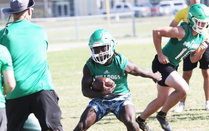 Suwannee running back Marquavious Owens rushes up the field during practice on May 1. (JAMIE WACHTER/Lake City Reporter)