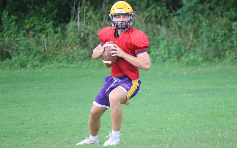 Columbia quarterback Evan Umstead drops back to pass during practice on Wednesday. (JORDAN KROEGER/Lake City Reporter)