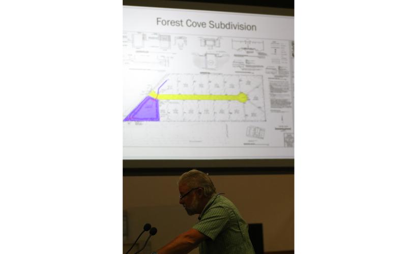 Assistant County Manager Kevin Kirby discusses the county’s design and maintenance manual for subdivisions Thursday as an example for how MSBUs would work using the Forest Cove subdivision is shown behind him. (JAMIE WACHTER/Lake City Reporter)