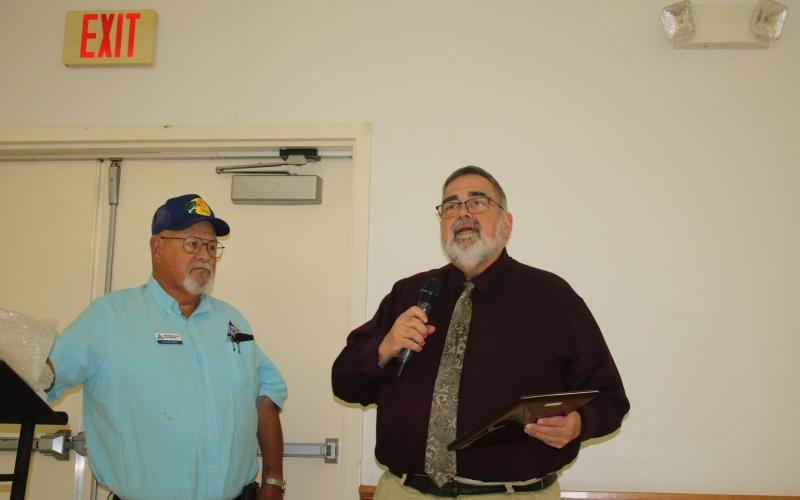 Columbia County Manager David Kraus speaks Tuesday after receiving the Columbia County Farm Bureau’s Public Service Award from Richard Jones. (TONY BRITT/Lake City Reporter)