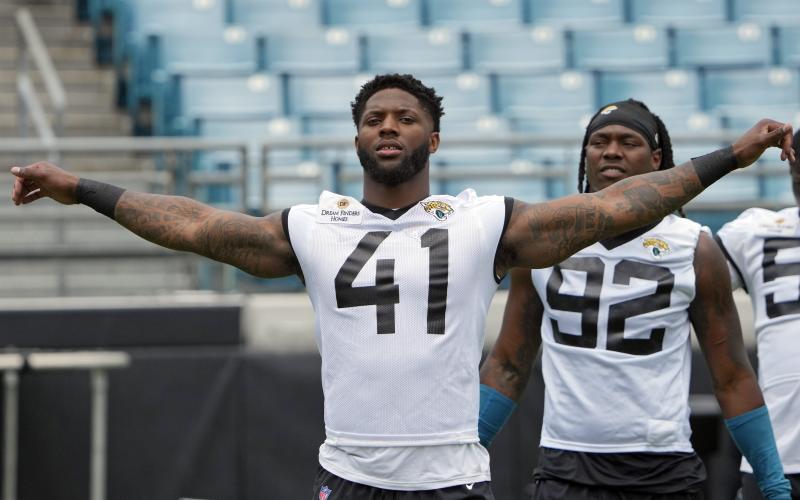 Jacksonville Jaguars linebacker Josh Allen loosens up before practice on Monday in Jacksonville. (JOHN RAOUX/Associated Press)