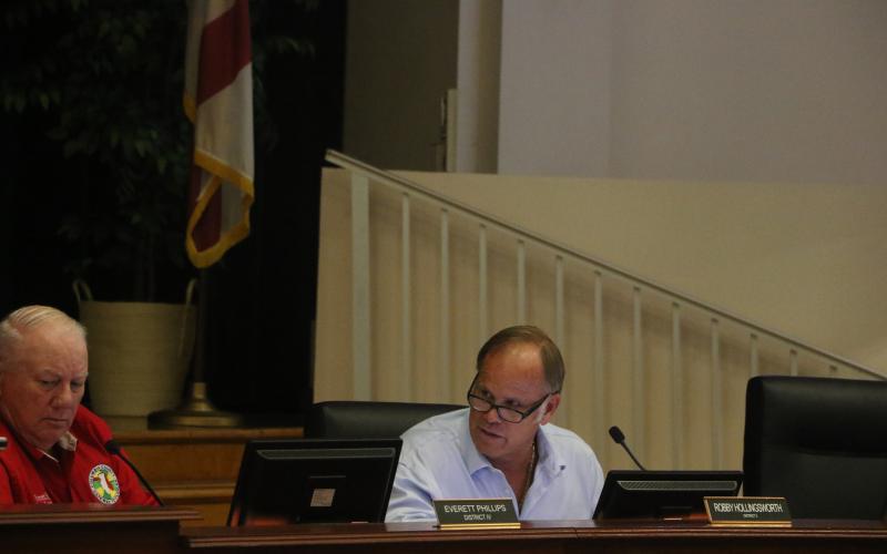 Columbia County Commissioner Robby Hollingsworth (right) speaks next to Commissioner Everett Phillips during Waste Pro’s presentation at the commission’s meeting Thursday night. (MORGAN MCMULLEN/Lake City Reporter)